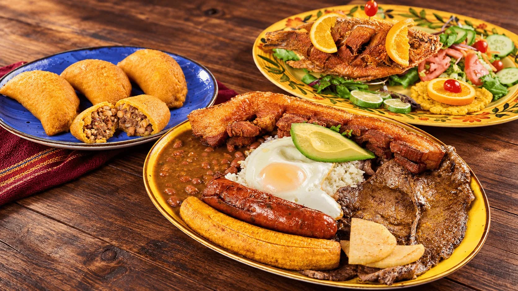 Colombian bandeja paisa, empanadas and fried mojarra at Antojitos y Más in Elizabeth