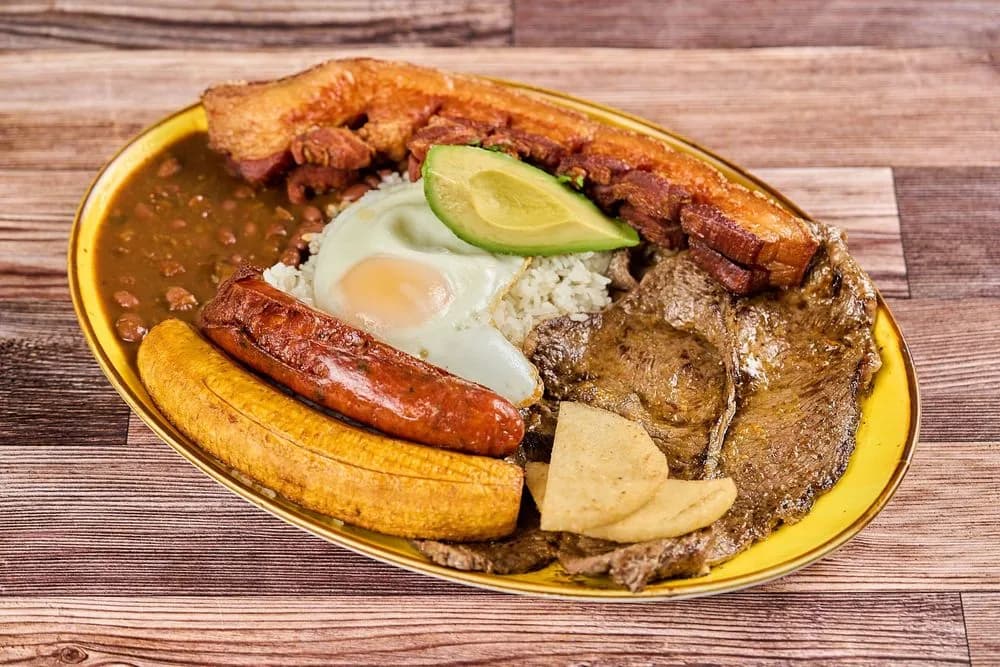Bandeja paisa with rice, beans, chicharrón, egg and avocado